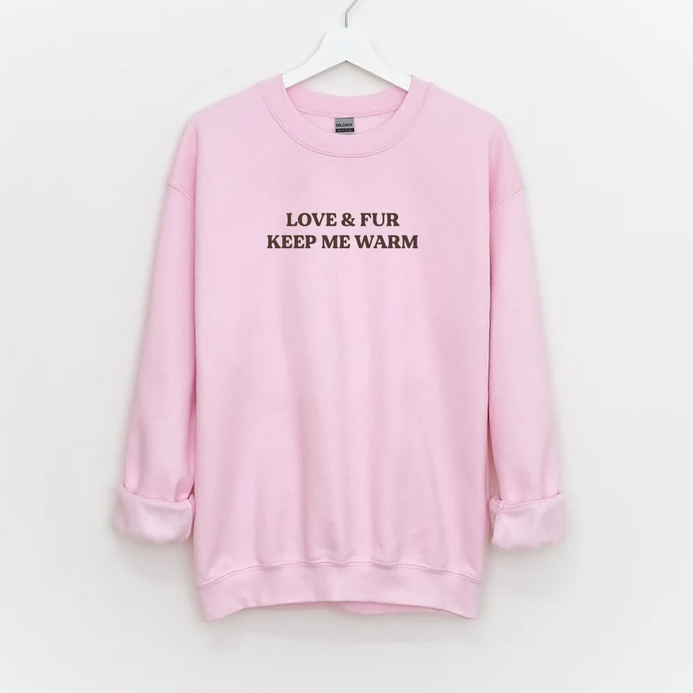 Unisex sweatshirt with text “LOVE & FUR KEEP ME WARM” — cozy crewneck pullover for dog and cat lovers.