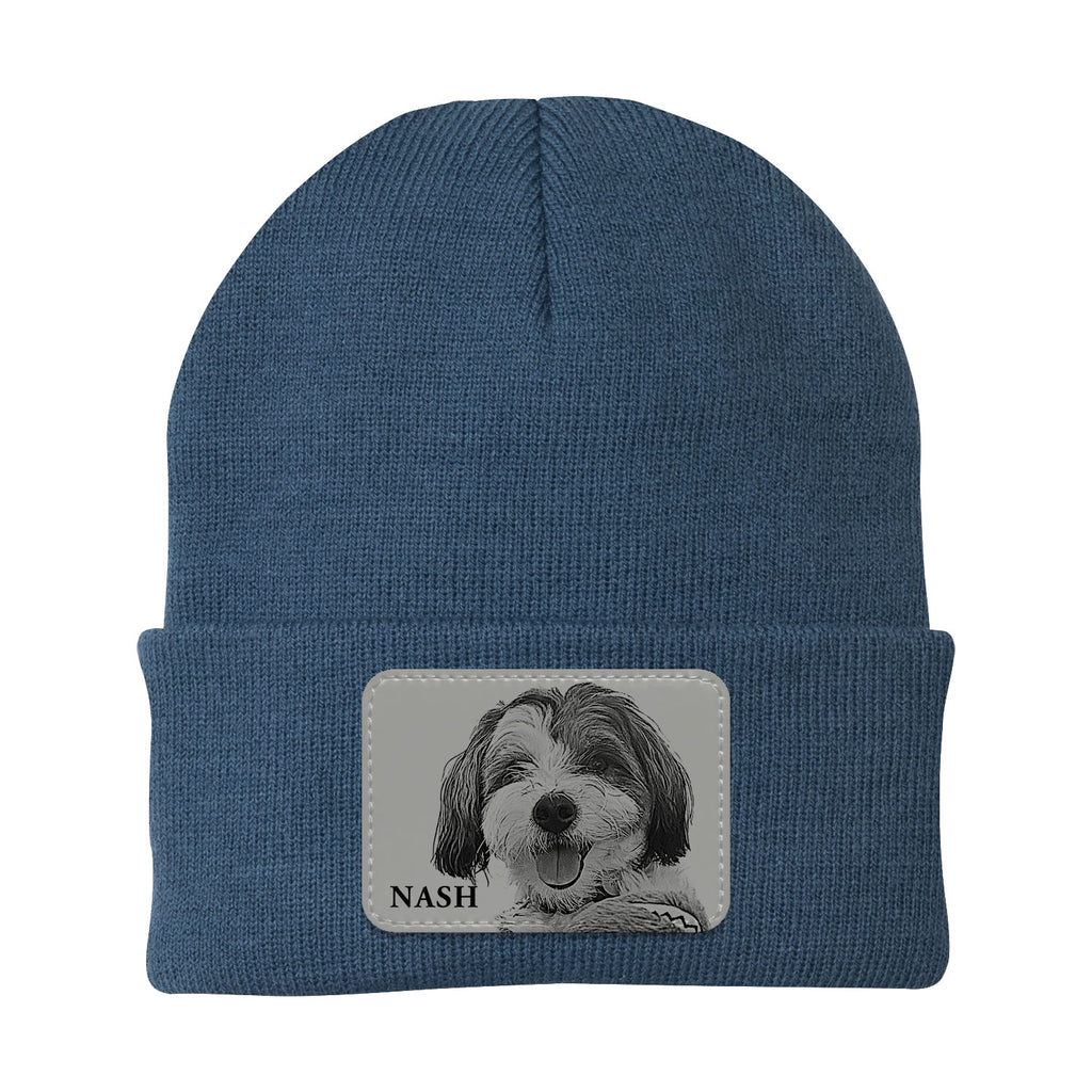 Blue beanie with a patch of a dog's face and name 'Nash' on a white background