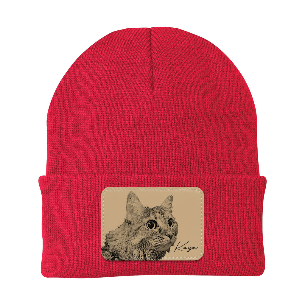 Red beanie with a cat patch and 'Kaya' branding on a white background