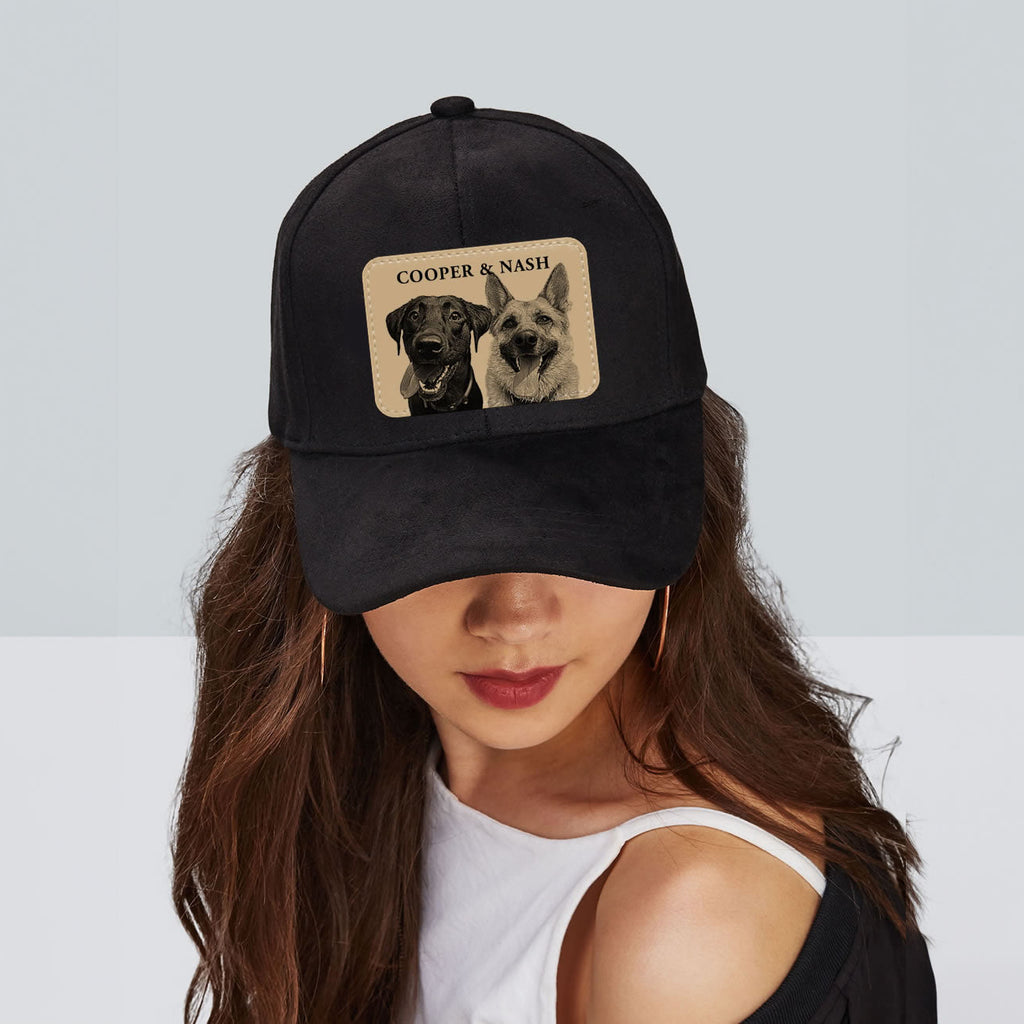 Black cap with dog pictures and text worn by a person on a light gray background