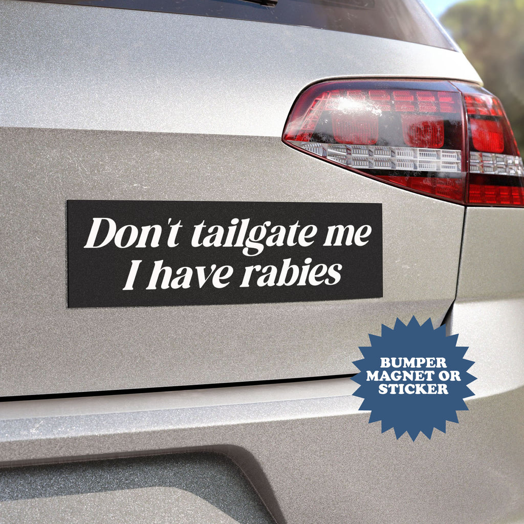 Car bumper with a humorous bumper magnet or sticker message 'Don't tailgate me I have rabies'.