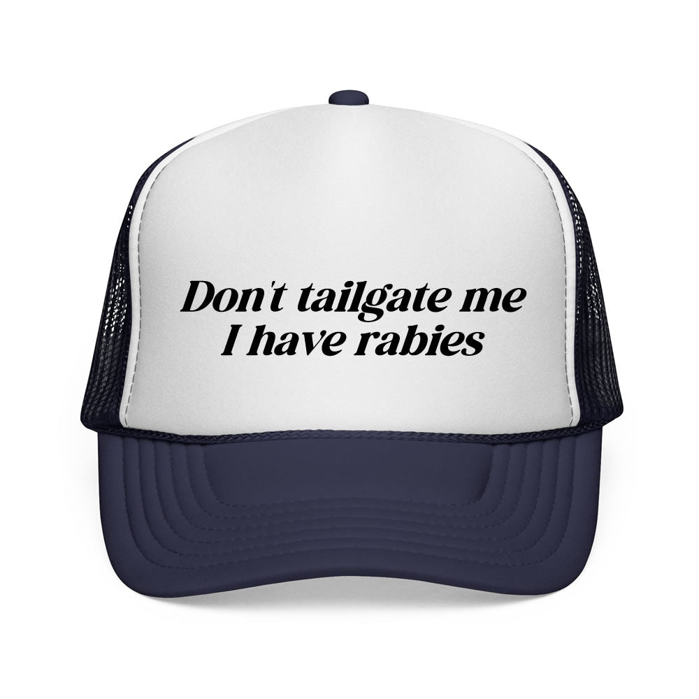 Trucker hat with text 'Don't tailgate me I have rabies' on a white background