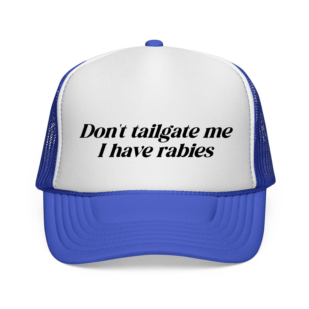 Blue and white trucker hat with text 'Don't tailgate me I have rabies' on a white background