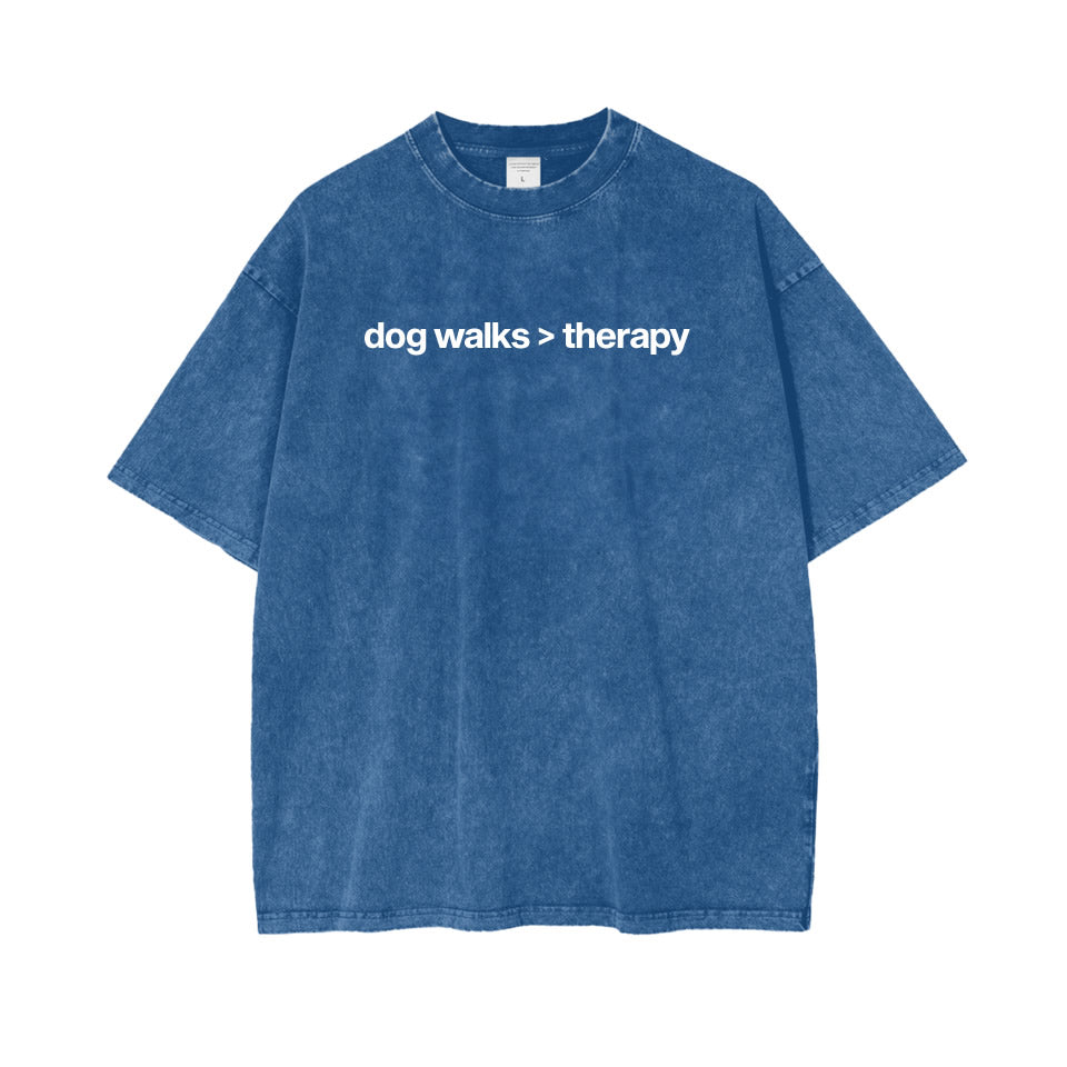 Washed black oversized cotton t‑shirt with drop shoulder design and white text “dog walks > therapy” — unisex funny dog lover graphic tee.