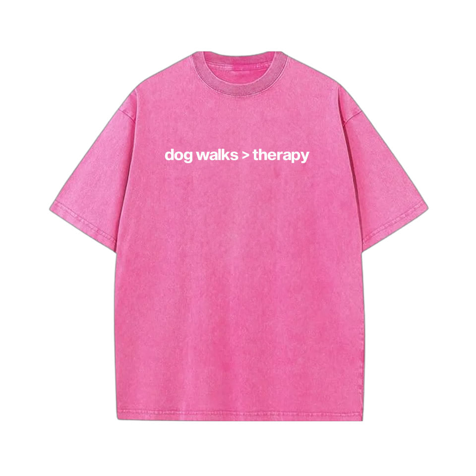 Washed black oversized cotton t‑shirt with drop shoulder design and white text “dog walks > therapy” — unisex funny dog lover graphic tee.